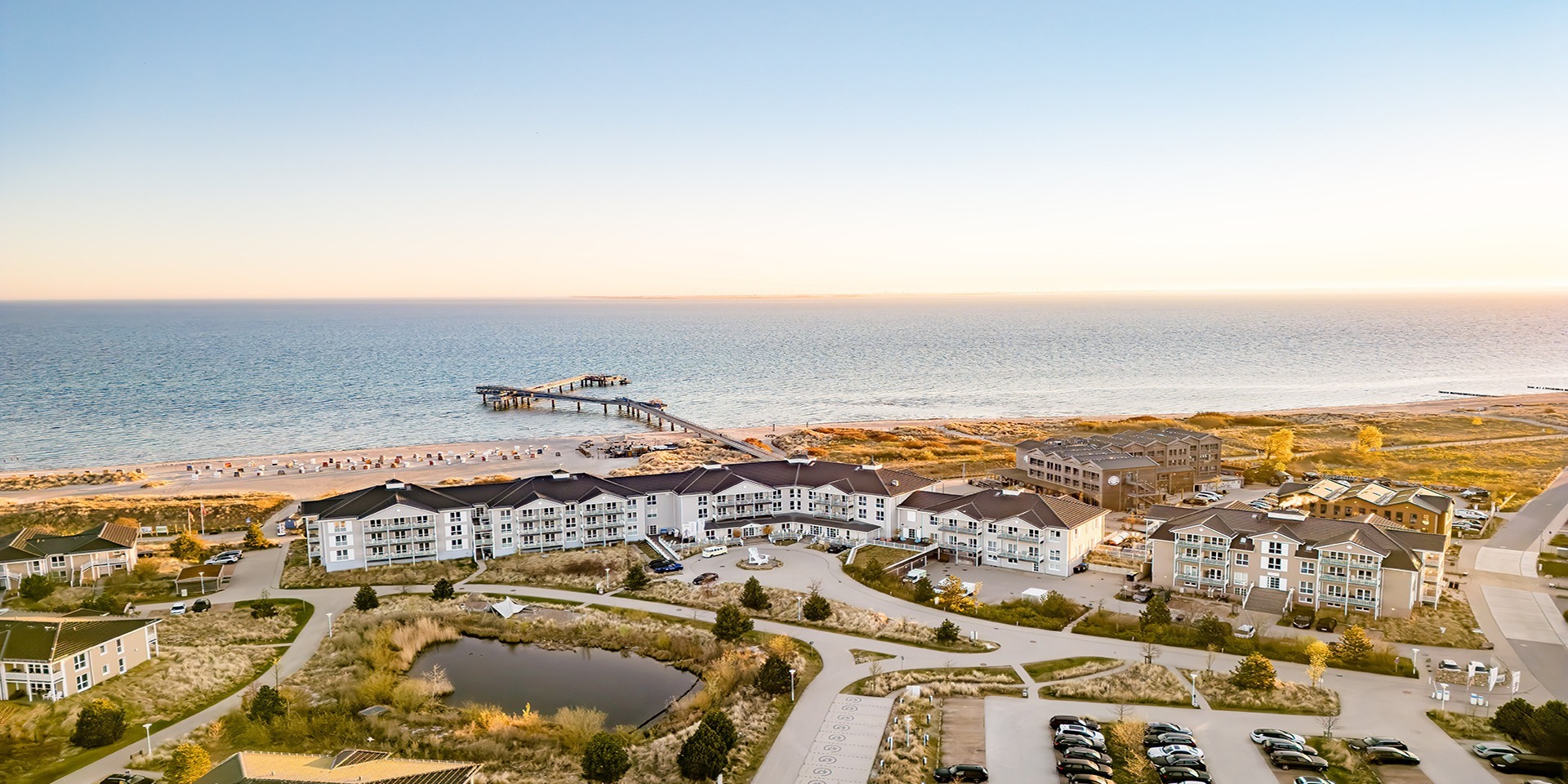 Aerial view of a Heimathafen hotel by the sea
